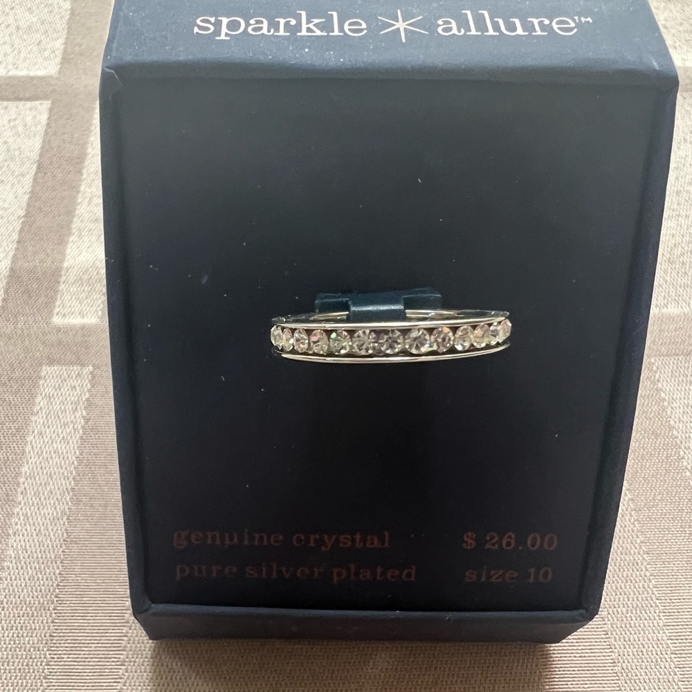 Silver plated ring with genuine crystals throughout the band, size 10, NWT